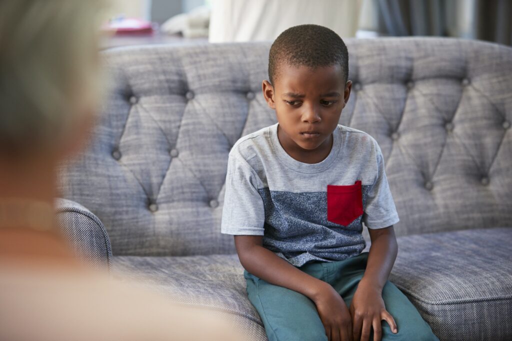 Young boy having therapy with a child psychologist