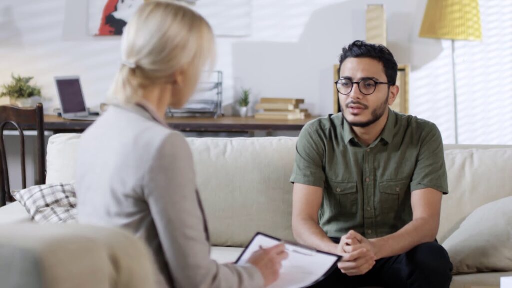 A young man having a counselling session